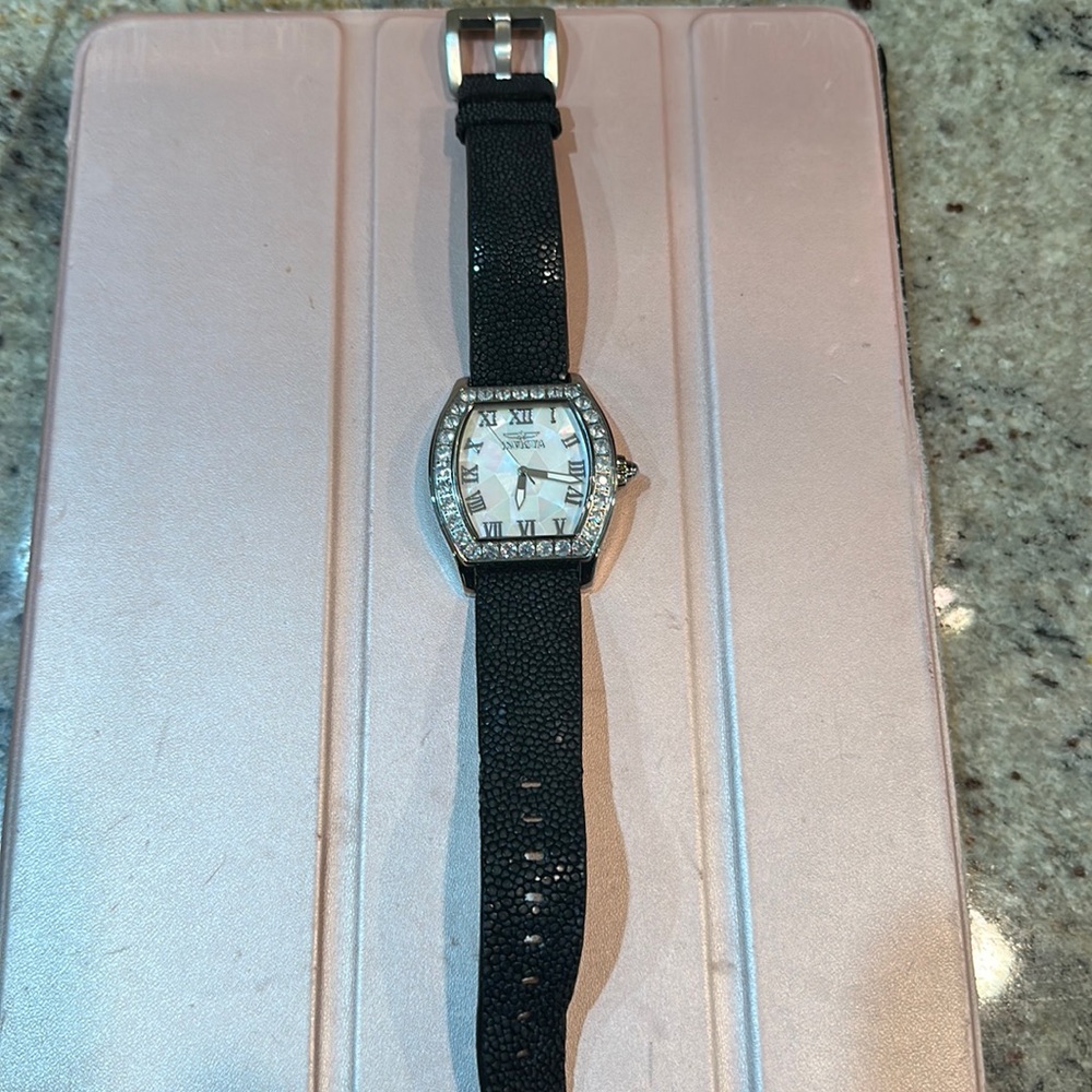 Invicta Angel. Blue Mon Quartz. Mother pearl face. Needs battery.
